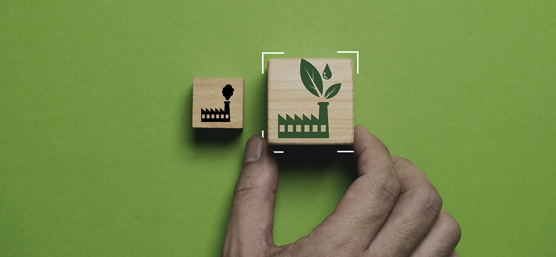 Hand holding to select between green factory and pollution manufacturing for green economy to reduce carbon dioxide emission from Kyoto protocol within 2050 ,Sustainability environment concept. life cycle assessments industries